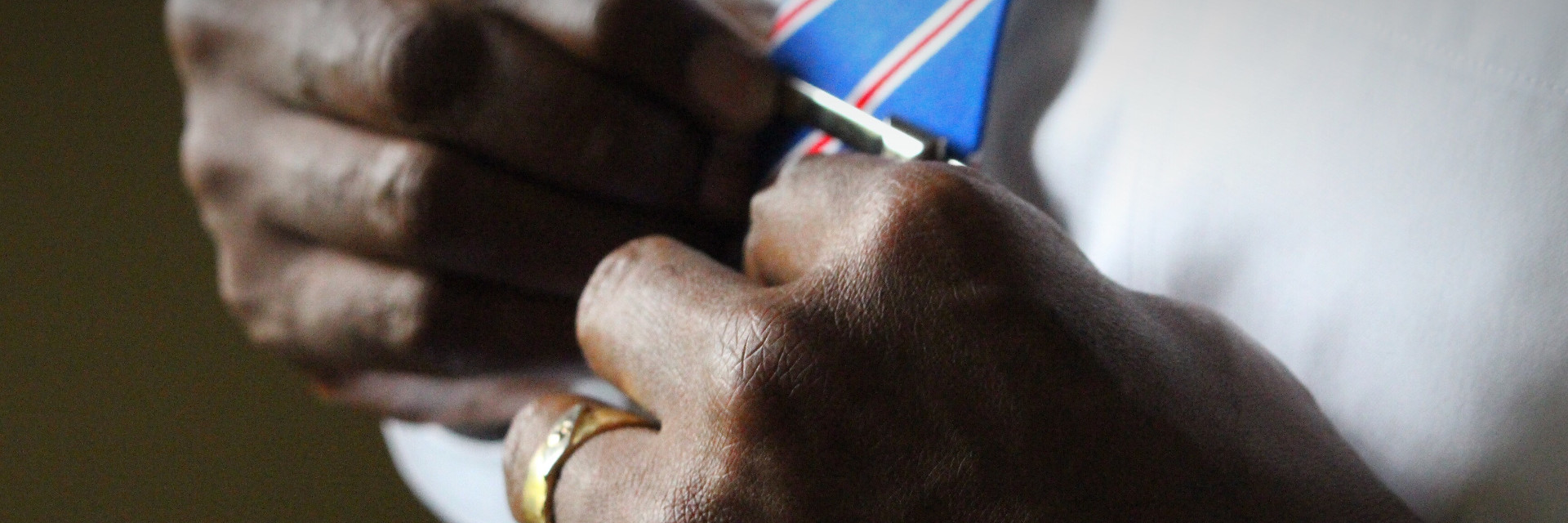 Bishop puts on a tie